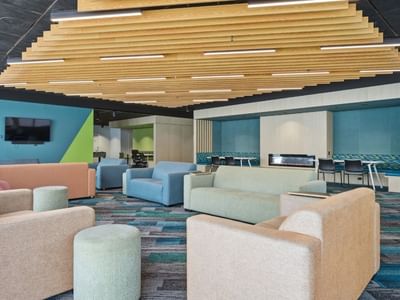 Colorful lounge area with couches and chairs in Mayoral Drive Student Accommodation.