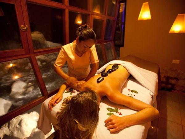 woman getting massaged in spa room