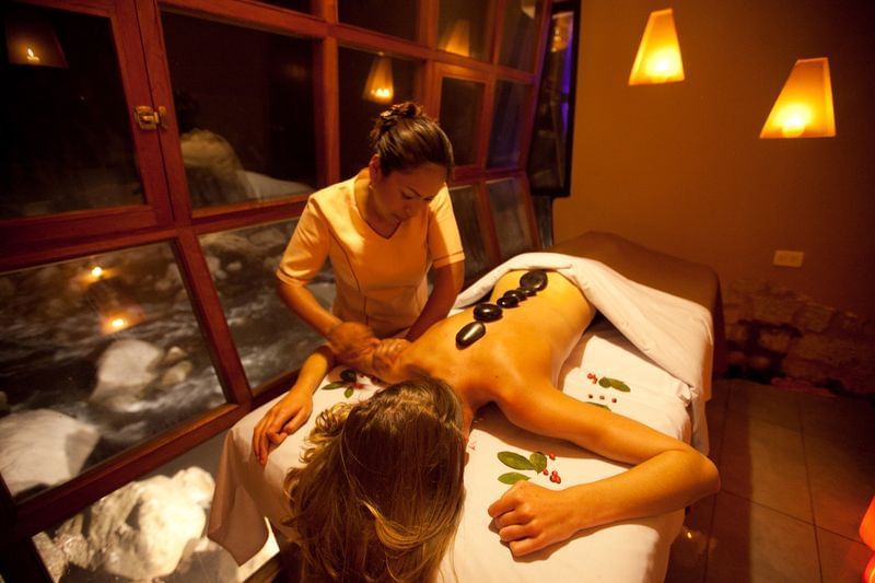 woman getting massaged in spa room in aguas calientes peru