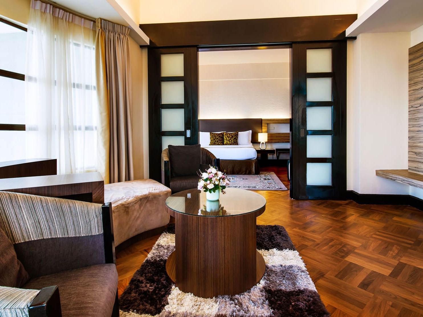 The living area of the Premium Suite with a couch and a coffee table at the Thistle Port Dickson Resort