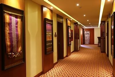 Interior of the hallway with large pictures hung at Hotel Sumaq