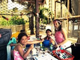 Children painting in Kids Club at Lake Buena Vista Resort Village & Spa