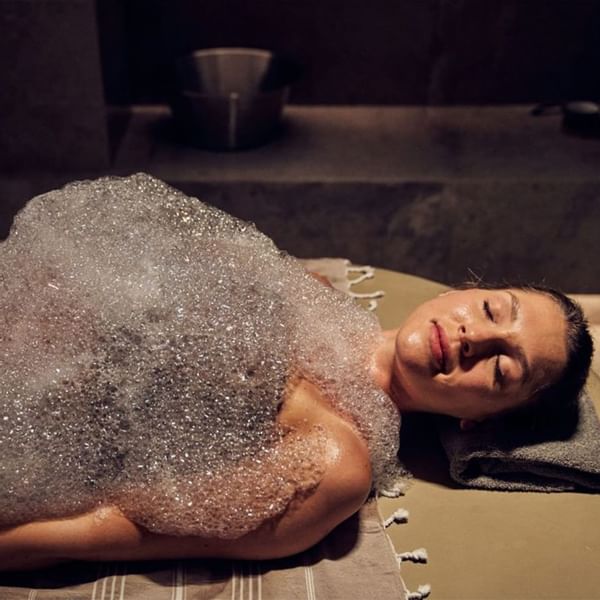 A lady in Acquapura Spa receiving a therapy at Falkensteiner Hotels & Residences