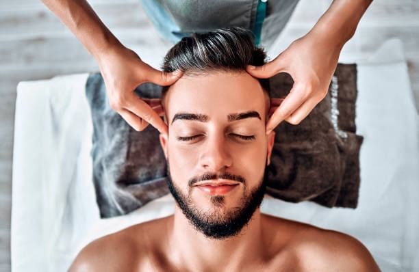 Man enjoying head massage at Orsett Hall Hotel