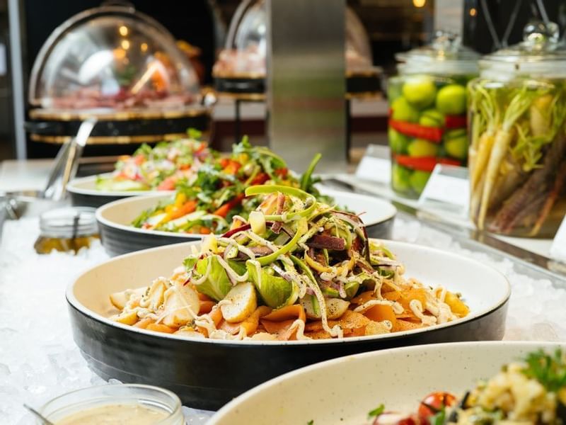 Assorted fresh salads on bowls in a buffet served in a restaurant at Crown Hotels Perth