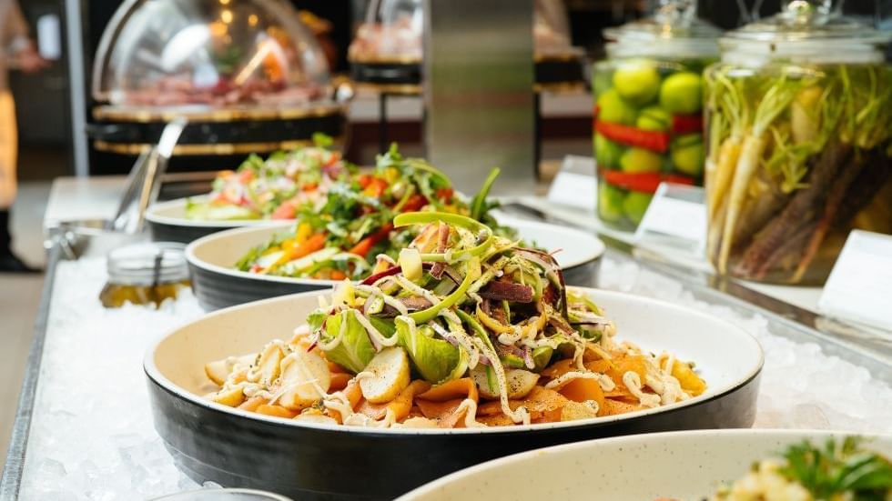 Assorted fresh salads on bowls in a buffet served in a restaurant at Crown Hotels Perth