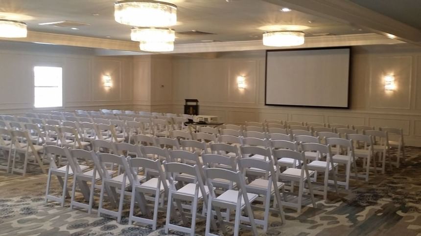 Arranged Crystal Hall with chairs at Palmera Inn and Suites