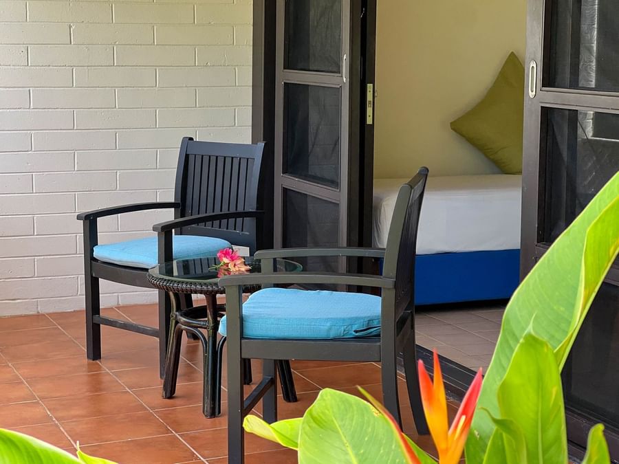 Patio seating with flower and table at The Naviti Resort - Fiji.