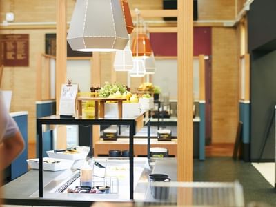 A buffet line with food and drink items at La Trobe University - Glenn College.