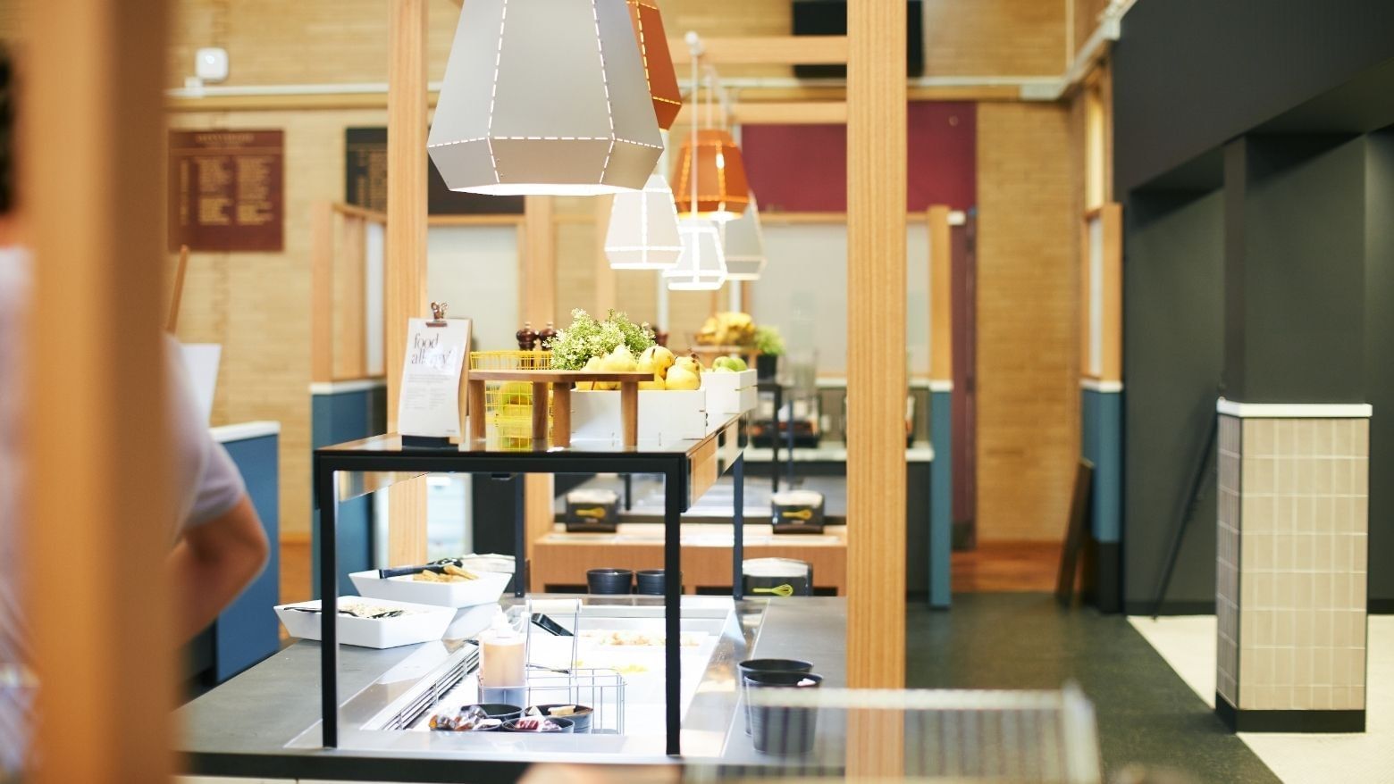 A buffet line with food and drink items at La Trobe University - Glenn College.