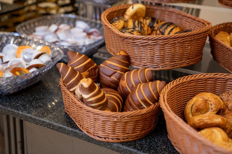 breakfast buffet of freshly baked chocolate-striped croissants in a woven basket at Saja by Warwick Makkah