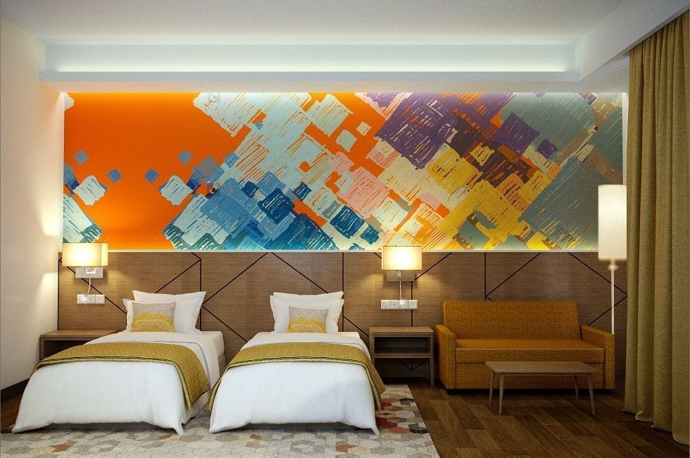Deluxe Twin Bedroom with two beds with an abstract art piece above the bed and sofa at  Sunway Hotel Big Box