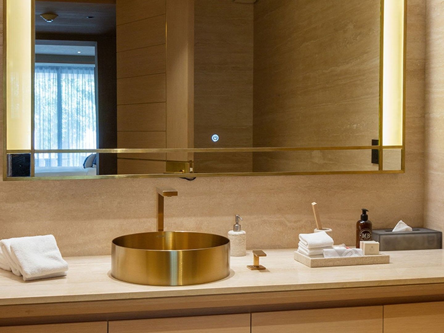 King Superior Viceroys Suite bathroom featuring a gold sink and a large illuminated mirror at Camino Real Polanco Mexico