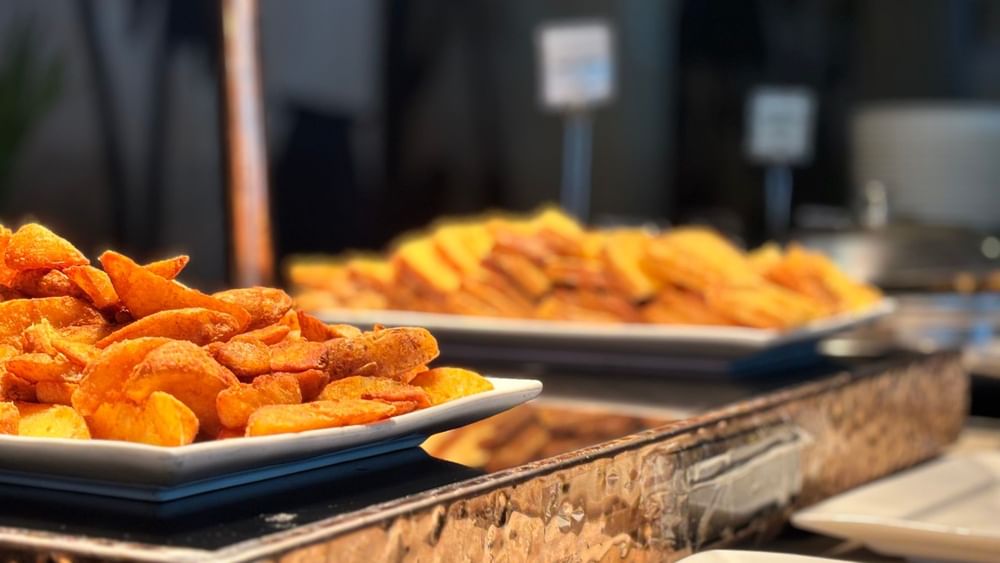 Plates of fried potato wedges at Bula Brasserie in Korolevu at Warwick Fiji Resort and Spa.