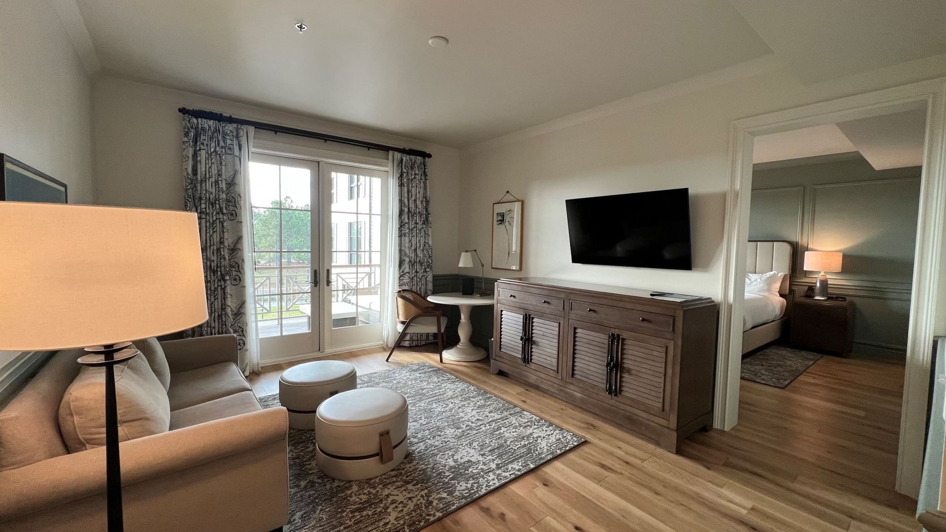 TV & comfy sofa in Pine Suite Livingroom with wooden interior at Camp Creek Inn