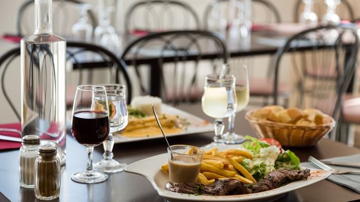 Dishes served in dining area at Hotel agora