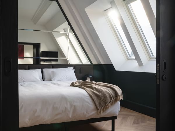 Cozy bed in Castle View Suite with a warm ambience at Almanac X Alcron Prague, Luxury Accommodation Prague