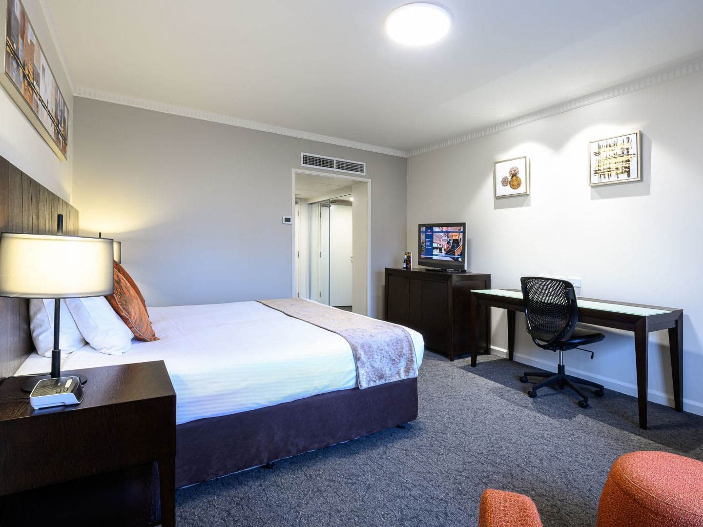 Bed & desk in Executive King at Grand Chancellor Adelaide