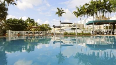 outdoor pool with palm trees