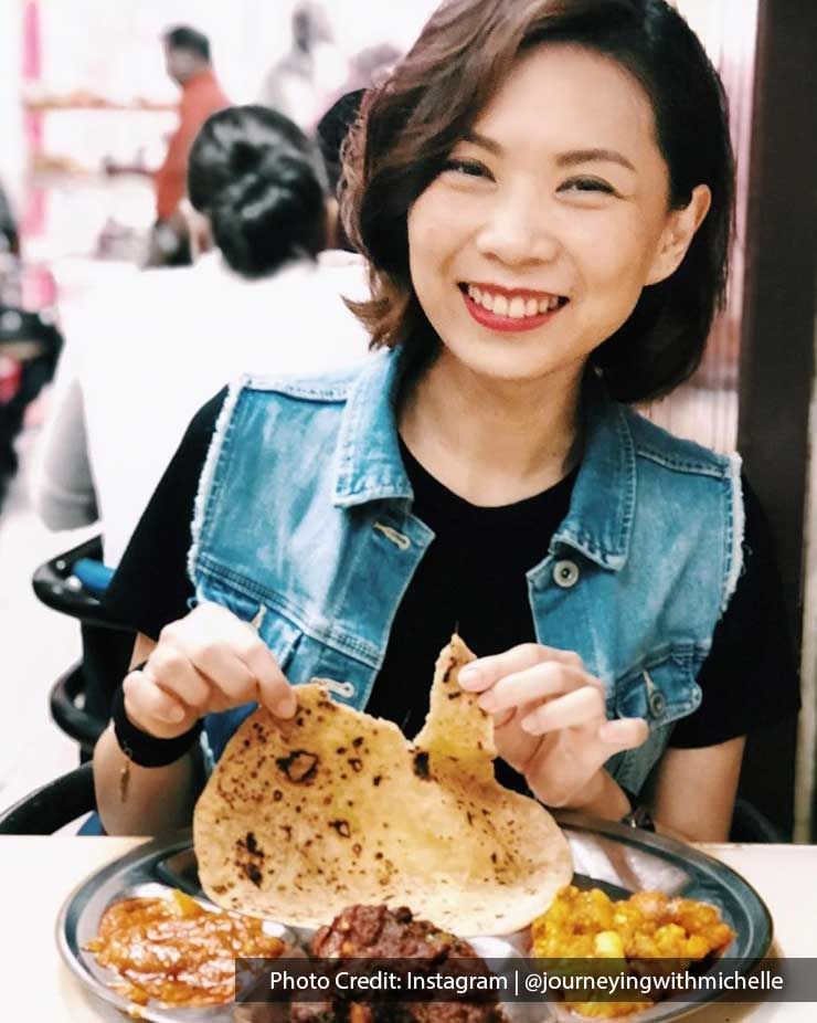 Lady enjoying an Indian cuisine in a Restaurant near Imperial Lexis, best Malaysian Restaurants Kuala Lumpur