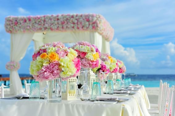 Fresh floral table decor arranged for a wedding by the beach at Holiday Inns Montego Bay