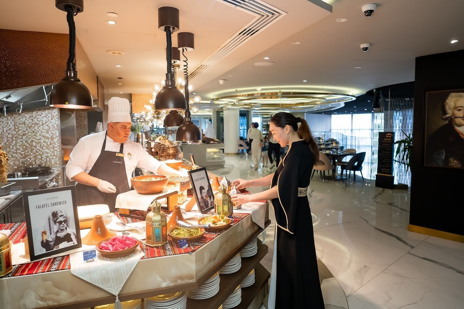 Chef presenting Iftar buffet spread in The Stage at Paramount Hotel Dubai