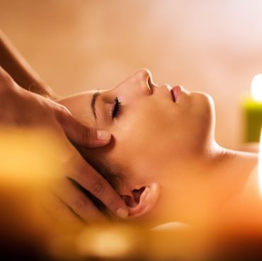 A lady having a facial massage in C'espace Spa at Cullinan Belek