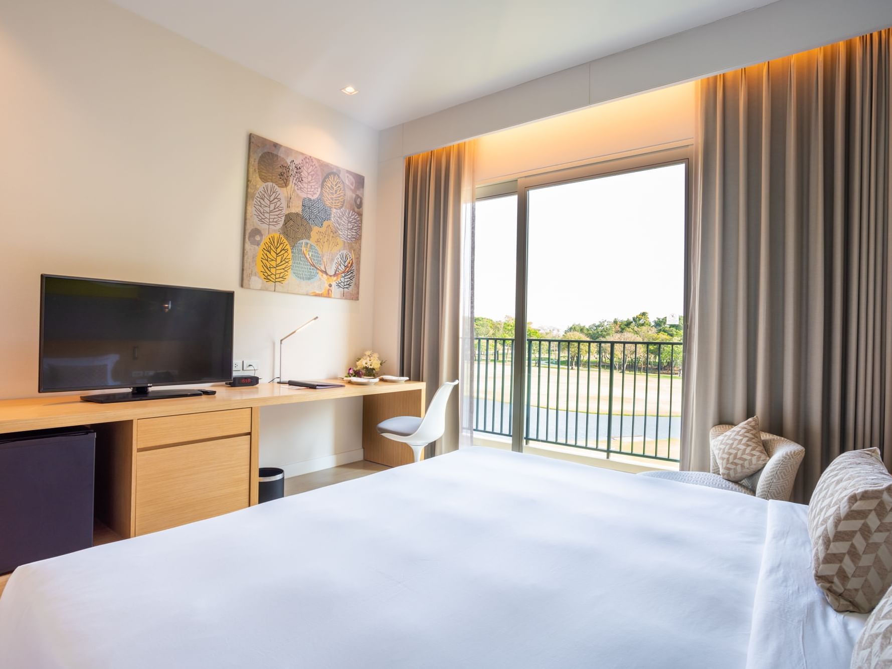 Terrace Golf Course View room with comfy bed, TV, work desk & balcony area at Eastin Thana City Golf Resort Bangkok