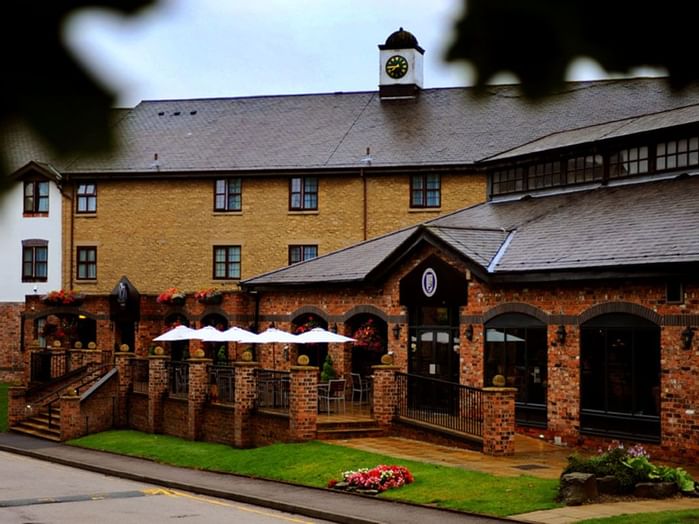 An exterior view of the hotel & main entrance at Village Hotels