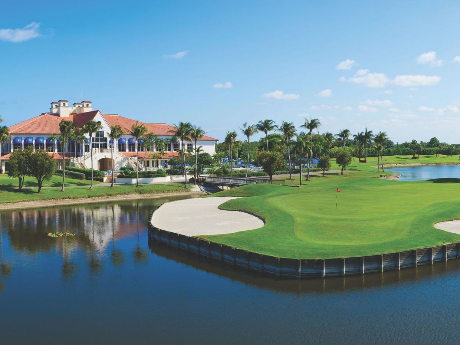 Aerial view of the golf course & river in Ocean Breeze Country Club near Ocean Lodge Boca Raton