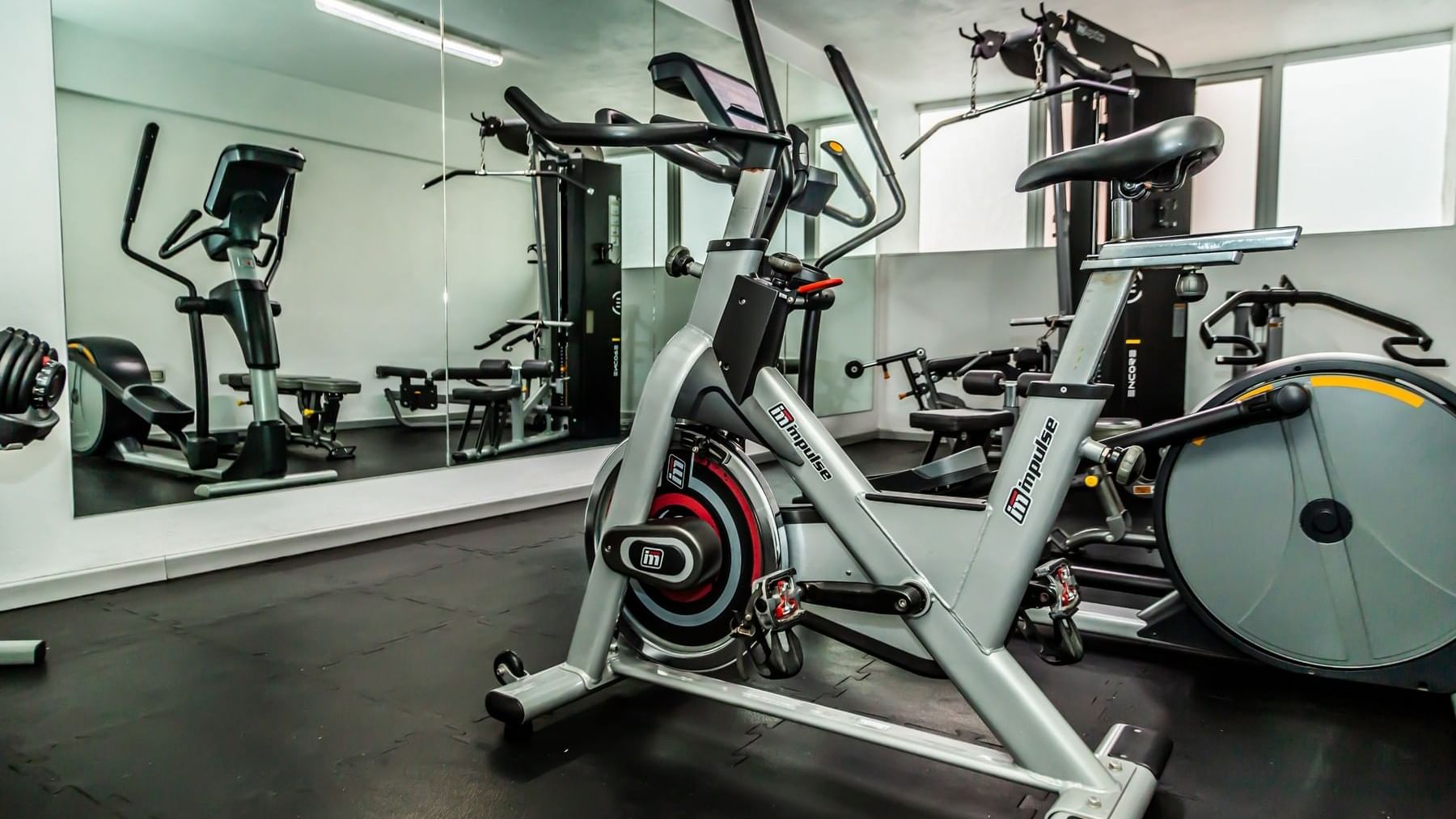 Stationary bike & fitness training euipment in the Gym at Gamma Hotels