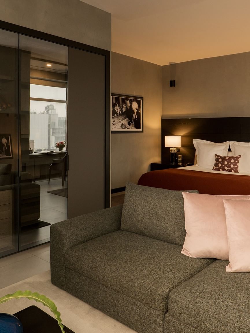 Spacious Duplex Penthouse with modern furnishings, glass partitions, and city views at Gansevoort Meatpacking NYC.