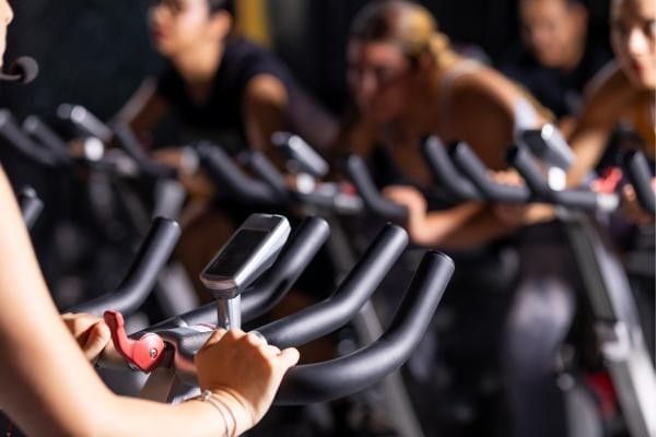 Close up image of people cycling at the gym featured in our article on the Cycle September in Bracknell.