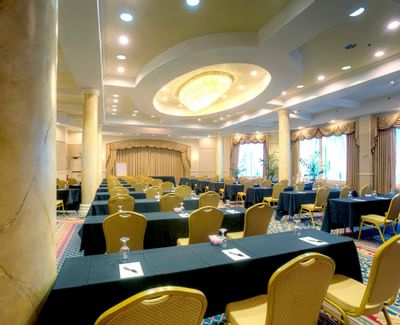 conference room with rows of tables and chairs