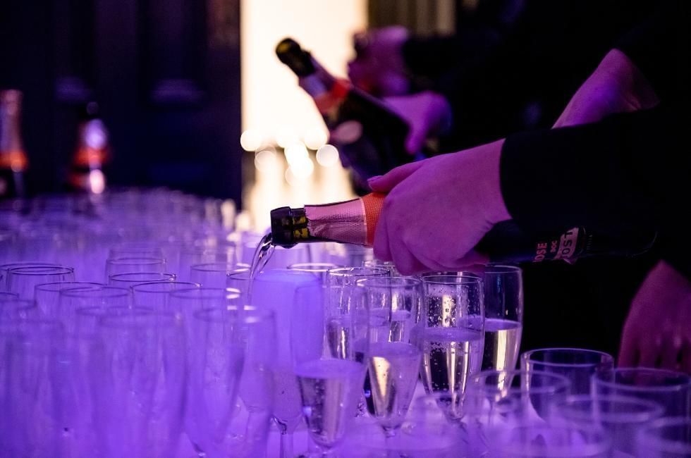 Prosecco being poured for party guests at Villiers Hotel offering some of the best Christmas parties in Buckinghamshire