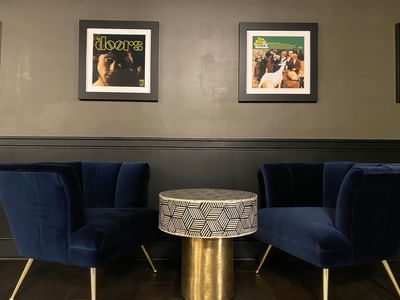 two chairs and a table in a hotel