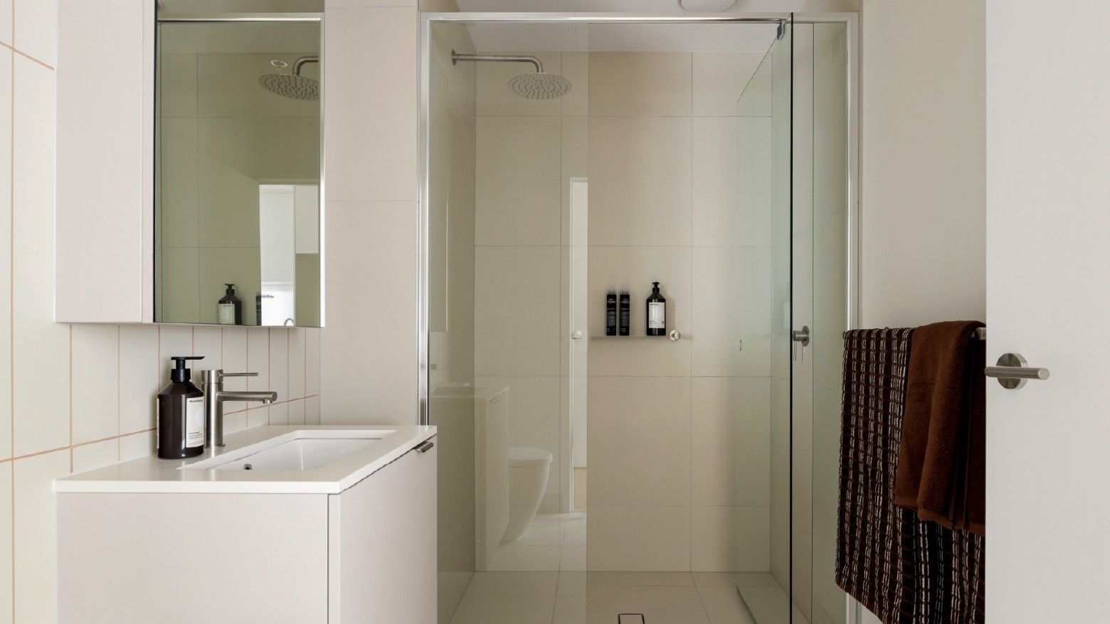 Photo of a simple bathroom (shower, toilet, sink) in an apartment at Swift Walk.