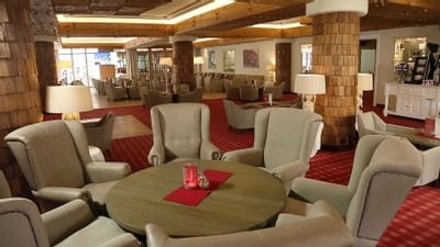 A table with wingback chairs in Lounge Bar at Liebes Rot Flueh