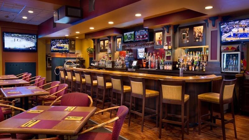 Dining tables and bar at restaurant