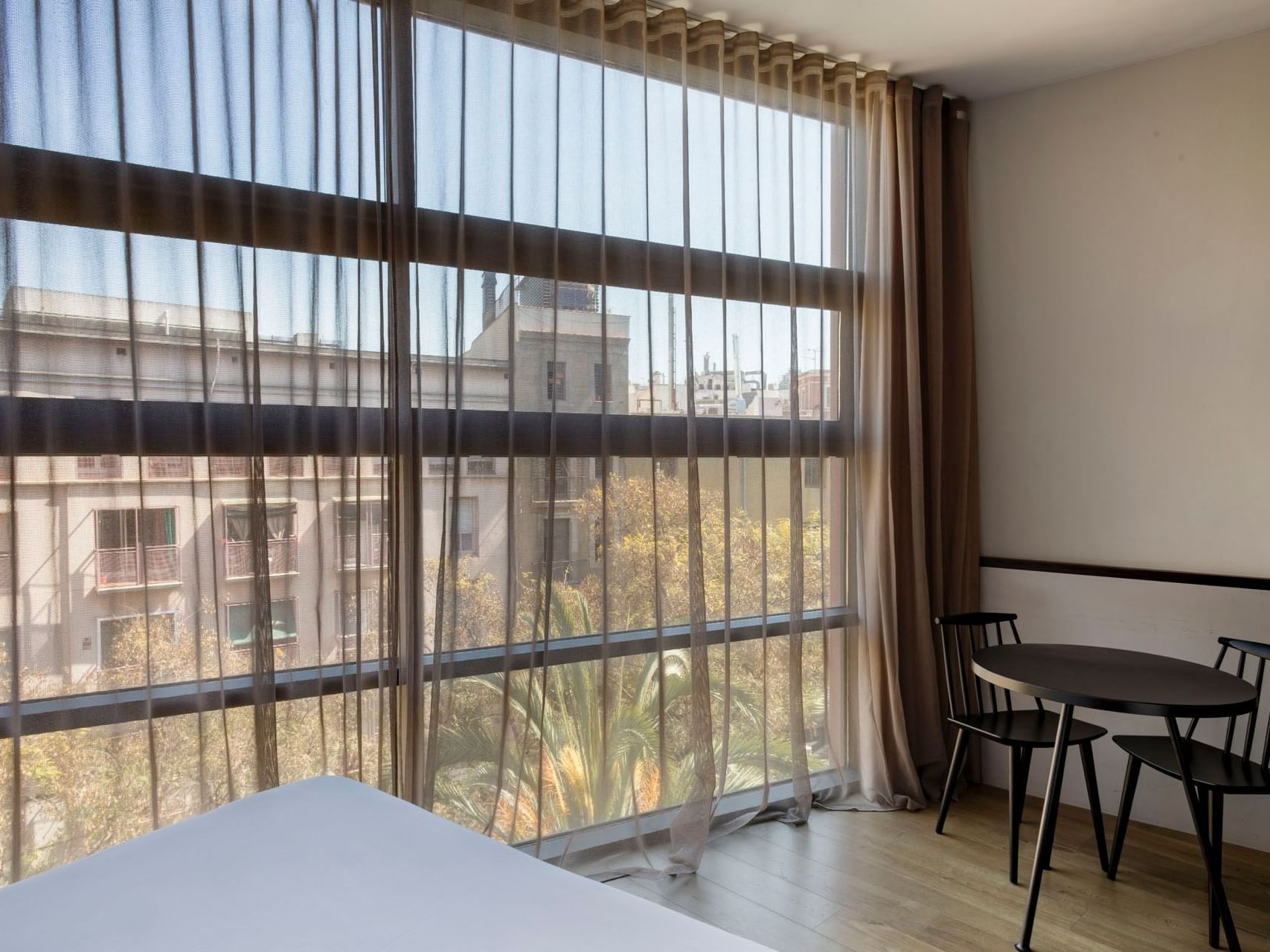Dining area by a window in Standard room at Aparthotel Allada