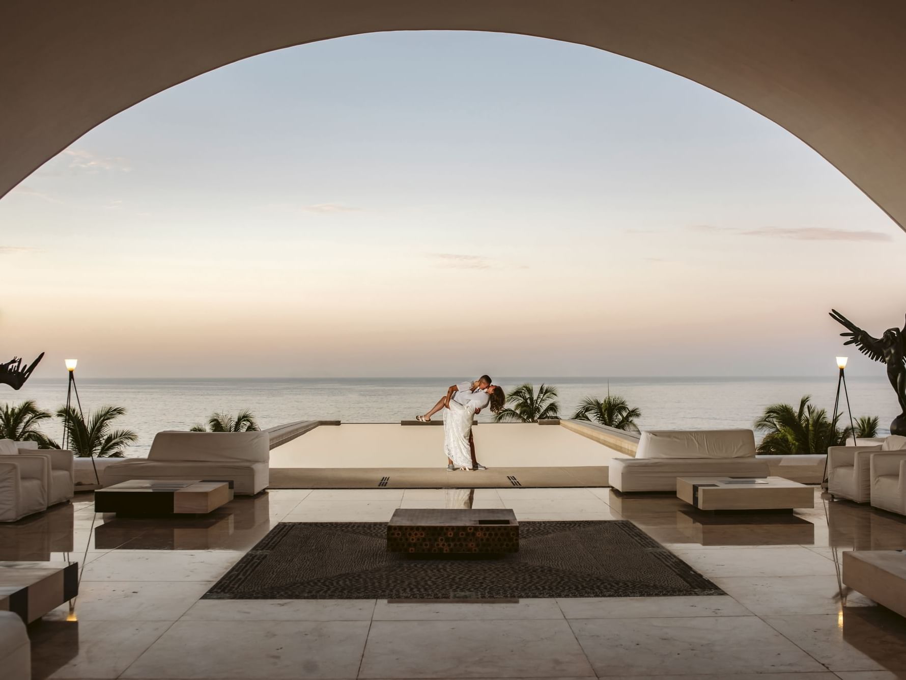 A romantic couple at the outdoor lobby in Marquis Los Cabos