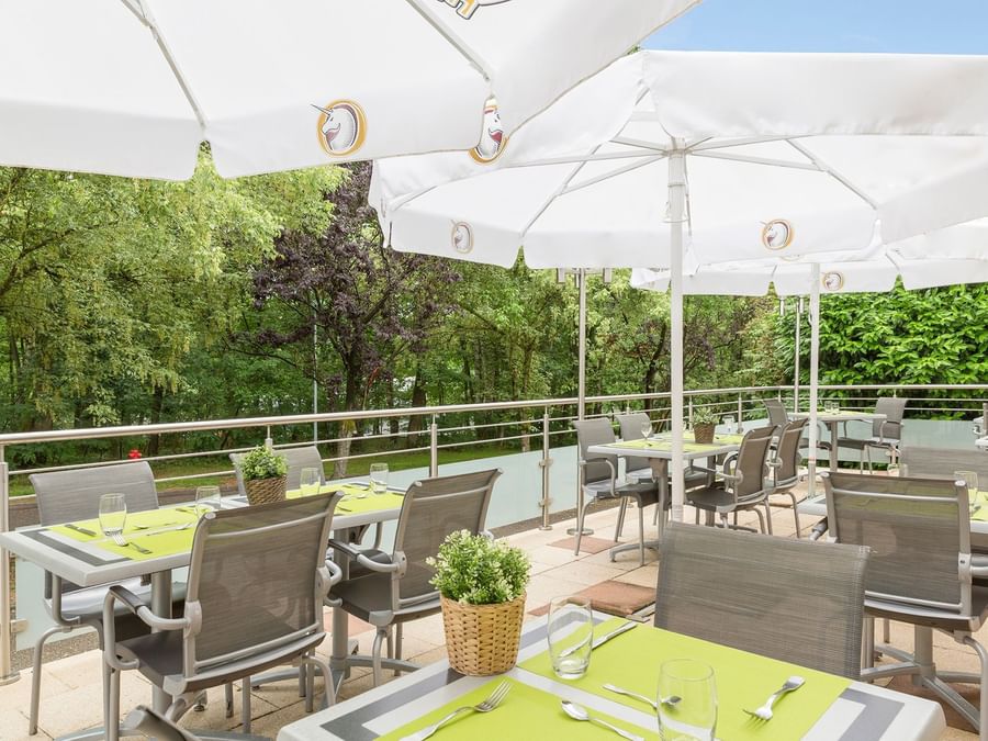 An outdoor dining & lounge area at  Hotel Aster