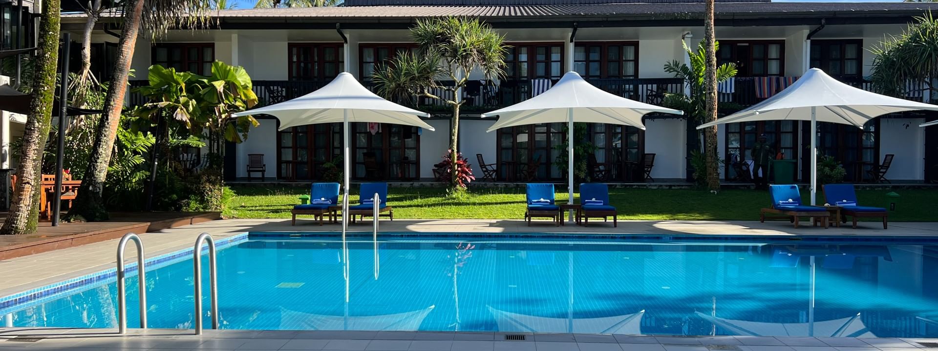 Adult only pool and bar with lounge chairs at Warwick Fiji Resort and Spa in Korolevu
