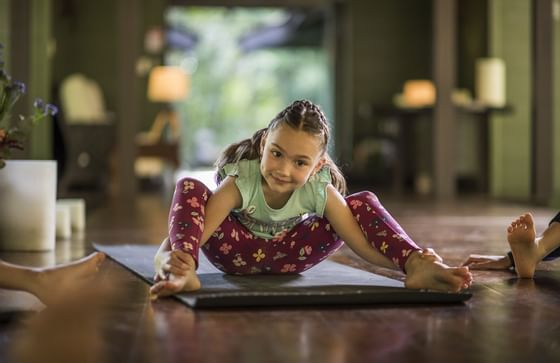 small girl in yoga pose