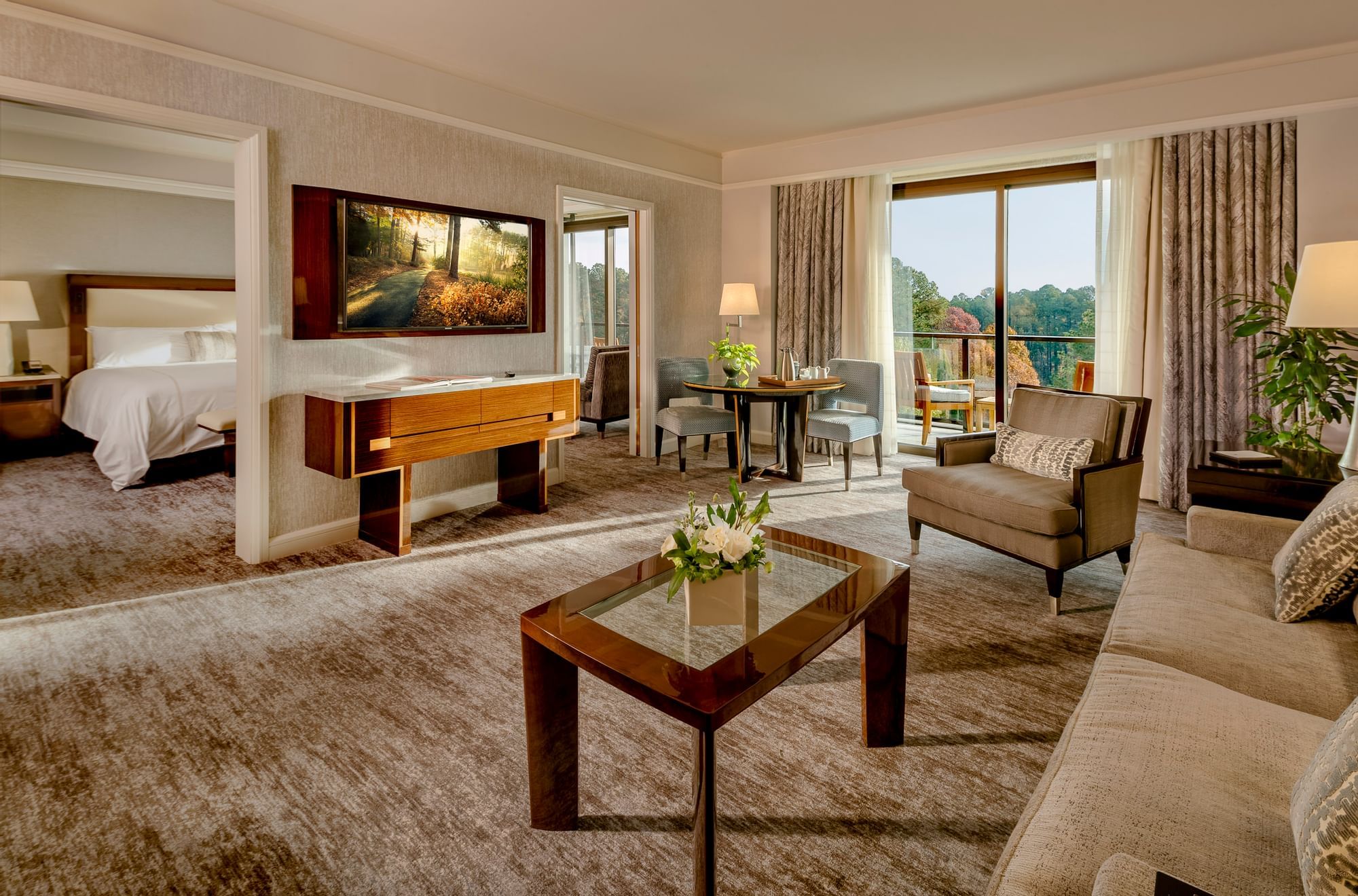 Spacious Living room which can be closed off in One Bedroom Lake View Balcony Suite at The Umstead Hotel and Spa