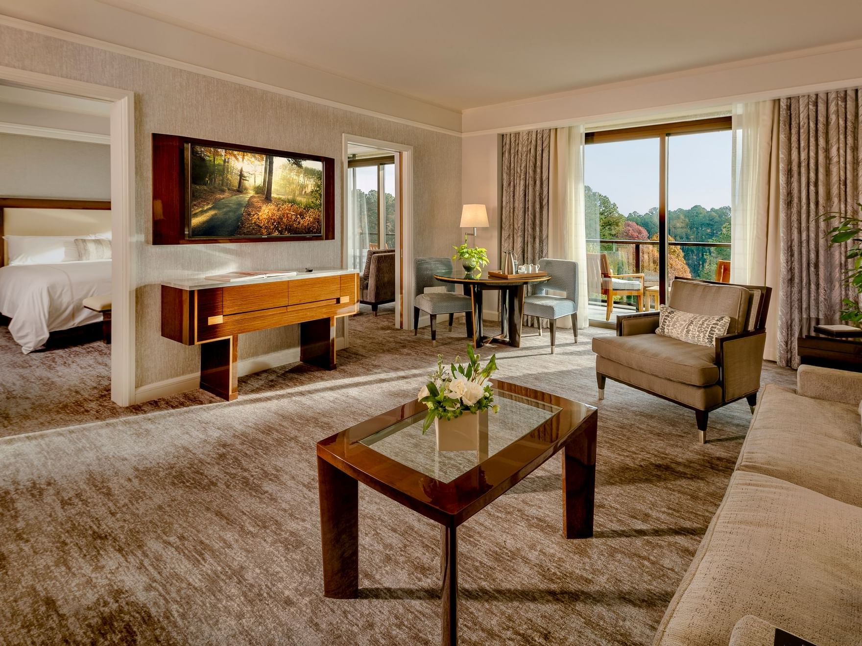 Spacious Living room which can be closed off in One Bedroom Lake View Balcony Suite at The Umstead Hotel and Spa