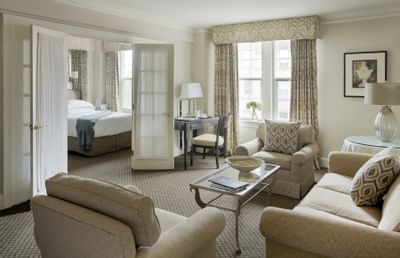 The living area next to a bedroom in a Suite at The Eliot Hotel