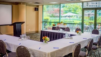 U-shaped table setup in Chevalier Room at Rosedale on Robson Suite Hotel, one of the best meeting rooms in Vancouver, BC