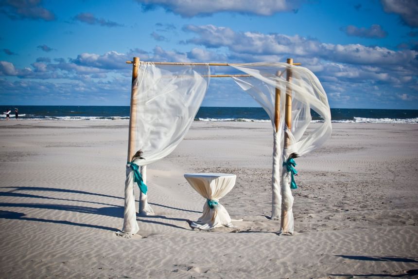 Close-up of wedding arch on the beach near ICONA Diamond