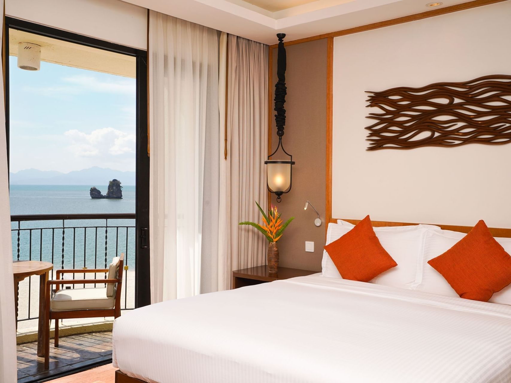 Bed & balcony in Bayu Senja Suite, Tanjung Rhu Resort Langkawi